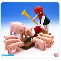 Farmer Feeding Pigs