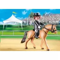 German Sport Horse with Dressage Rider and Stable
