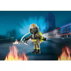 Fireman with burning tree