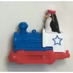 Pingouin conduisant une locomotive