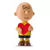 Charlie Brown holding an heart