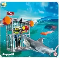 Diver in cage with Shark