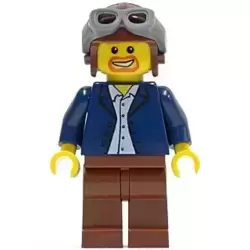 Dark Blue Jacket, Light Blue Shirt, Reddish Brown Legs, Aviator Cap and Goggles