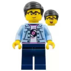 Man - Bright Light Blue Jacket, White Shirt with Record, Dark Blue Legs, Black Hair, Glasses