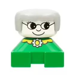 Duplo 2 x 2 x 2 Figure Brick, Grandmother, Green Base, Gray Hair, White Head, Yellow Collar with Flower
