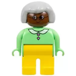 Duplo Figure - Female, Adult Woman, Yellow Legs, Medium Green Top with Collar and Heart Buttons Pattern, Light Gray Hair, Brown Head (75506)