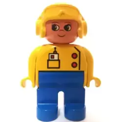 Duplo Figure, Female, Blue Legs, Yellow Top with Radio in Pocket, Yellow Aviator Helmet, Eyelashes, Turned Up Nose