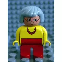 Duplo Figure, Female, Red Legs, Yellow Top with Red Necklace, Light Gray Hair, Glasses, White in Eyes