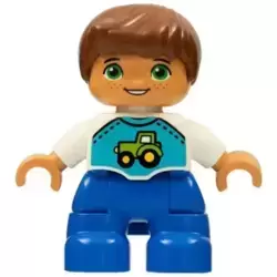 Duplo Figure Lego Ville, Child Boy, Blue Legs, White Top with Tractor Pattern, Reddish Brown Hair