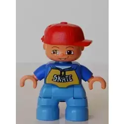 Duplo Figure Lego Ville, Child Boy, Medium Blue Legs, Blue Top with 'SKATE' Pattern, Red Cap, Freckles (4490150)
