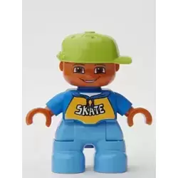 Duplo Figure Lego Ville, Child Boy, Medium Blue Legs, Blue Top with 'SKATE' Text Pattern, Lime Cap