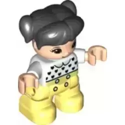 Duplo Figure Lego Ville, Child Girl, Bright Light Yellow Legs, White Top with Black Hearts, Black Hair with Pigtails, Light Nougat Skin (6335905)