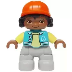 Duplo Figure Lego Ville, Child Girl, Light Bluish Gray Legs, Medium Azure Jacket with Capital Letter A and Buttons, Black Hair, Reddish Orange Riding Helmet (6474068)