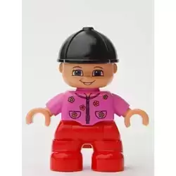 Duplo Figure Lego Ville, Child Girl, Red Legs, Dark Pink Top with Flowers, Black Riding Helmet