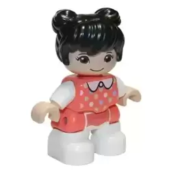 Duplo Figure Lego Ville, Child Girl, White Legs, Coral Top with Polka Dots Pattern, White Arms, Black Hair (6335901)