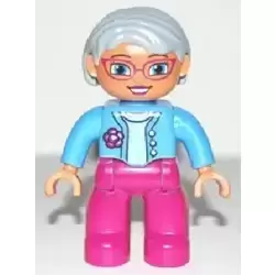 Duplo Figure Lego Ville, Female, Magenta Legs, Medium Blue Top with Flower, Light Bluish Gray Hair, Blue Eyes, Glasses