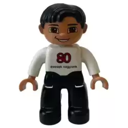 Duplo Figure Lego Ville, Male, Black Legs, White Top, Black Hair, '80 evesek vagyunk' on Front, LEGO Logo on Back