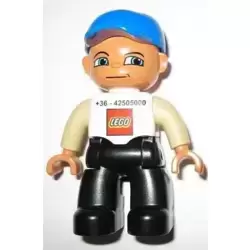 Duplo Figure Lego Ville, Male, Black Legs, White Top, Tan Arms, Blue Baseball Cap, LEGO Logo on Front - Lego Factory Hungary Promotional