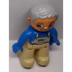 Duplo Figure Lego Ville, Male, Tan Legs, Blue Top with White Overalls Bib, Blue Hands, Light Bluish Gray Hair