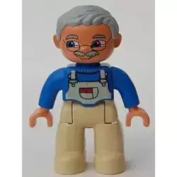 Duplo Figure Lego Ville, Male, Tan Legs, Blue Top with White Overalls Bib, Light Bluish Gray Hair