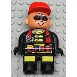 Duplo Figure, Male Action Wheeler, Black Legs with Yellow Patches, Red Straps, Sunglasses, Red Cap (4141905)