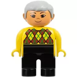 Duplo Figure - Male, Adult Man, Black Legs, Yellow Top with Argyle Pattern, Light Gray Hair, Nougat Head (75499)