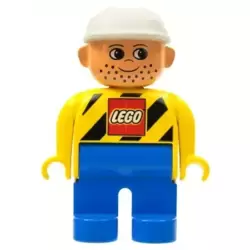 Duplo Figure, Male, Blue Legs, Yellow Top with LEGO Logo on Black Danger Stripes, White Construction Hat (4120077)