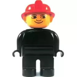 Duplo Figure, Male Fireman, Black Legs, Black Top (no buttons), Red Fire Helmet, no White in Eyes Pattern