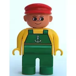 Duplo Figure, Male, Green Legs, Yellow Top with Green Overalls and Anchor, Red Cap